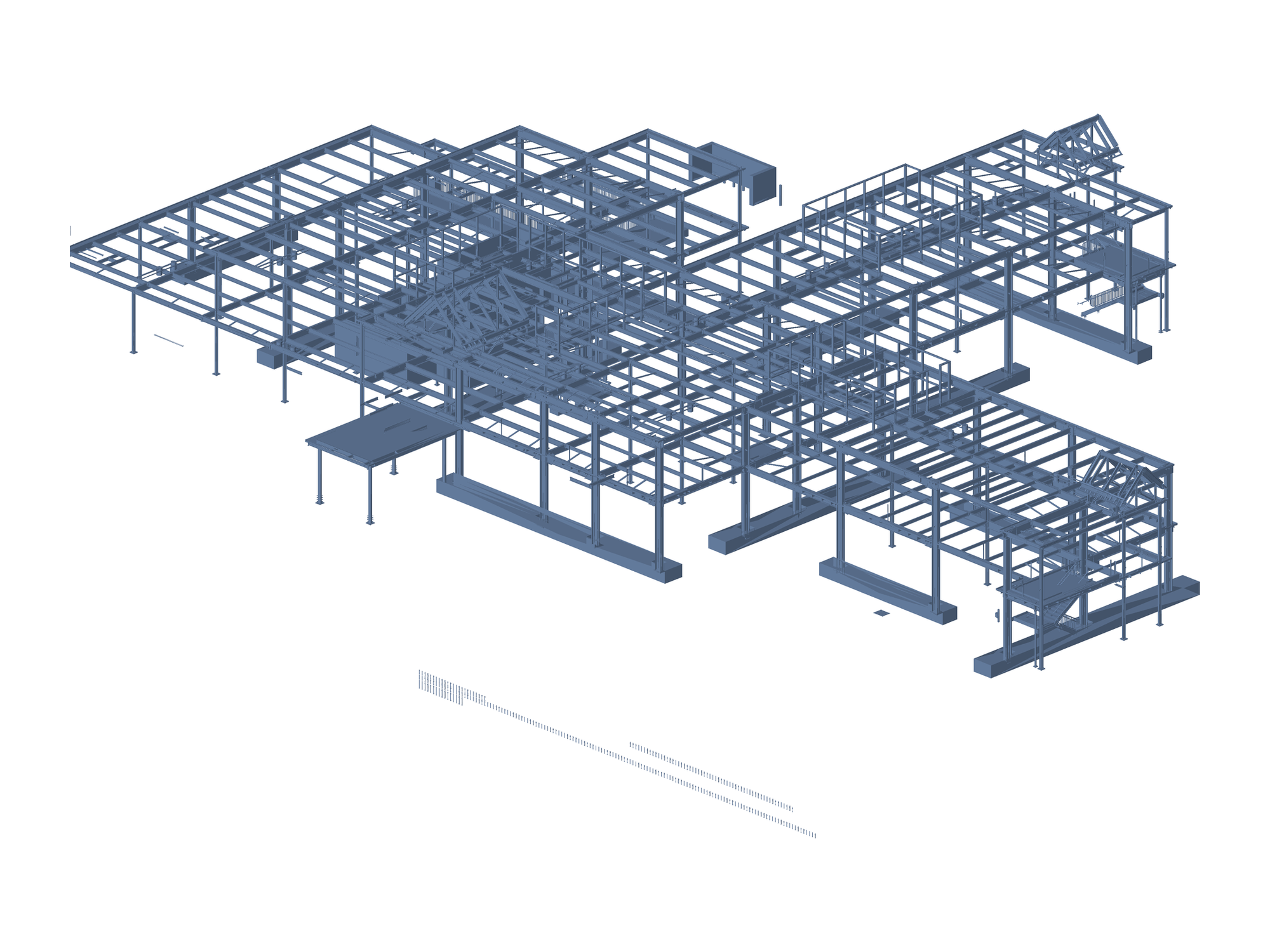 A whole low-rise building: several wings of framing under a braced roof